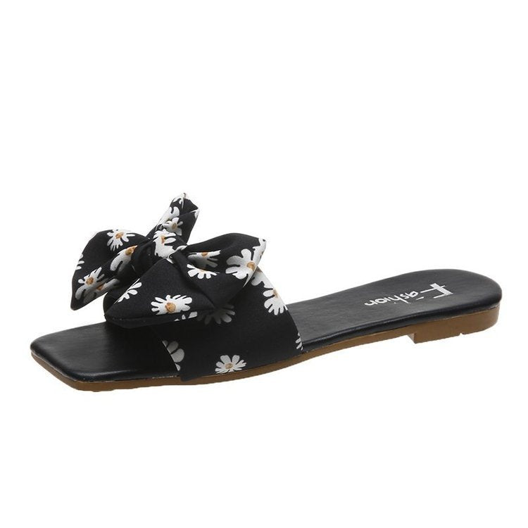 Dame fashionable slippers med legende blomsterdesign og elegante sløjfer Stilla