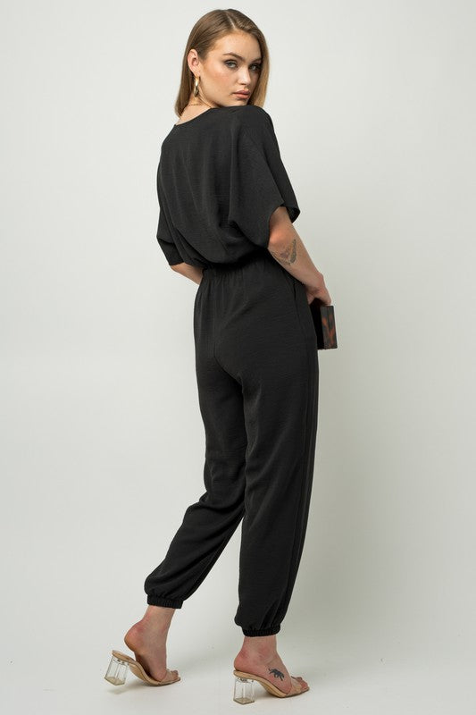 Stilla | Ærme Surplice Jumpsuit
