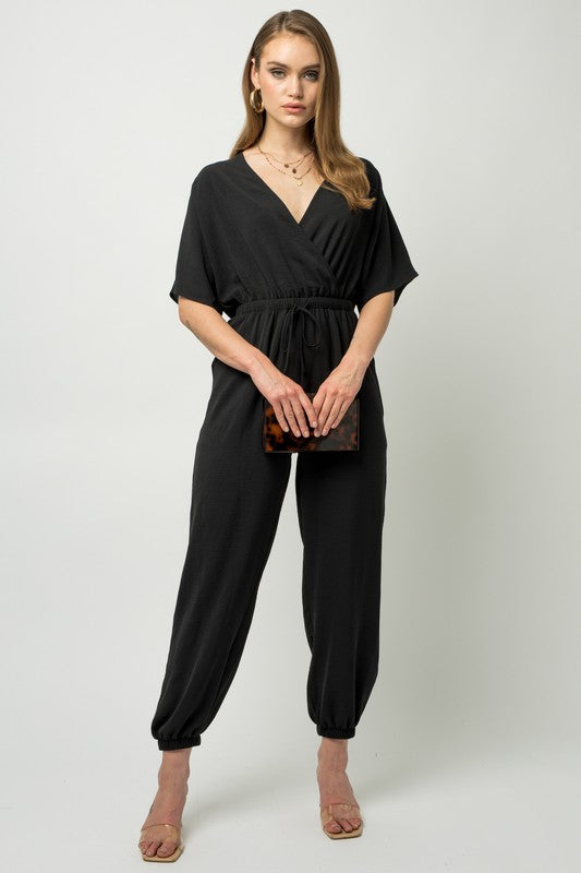Stilla | Ærme Surplice Jumpsuit