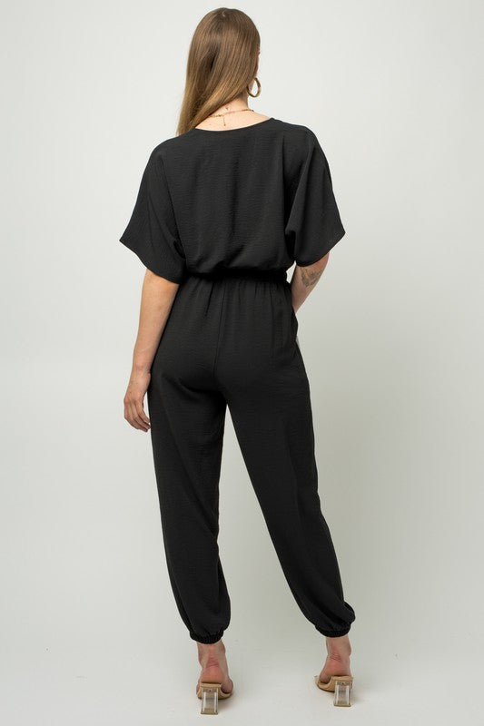 Stilla | Ærme Surplice Jumpsuit