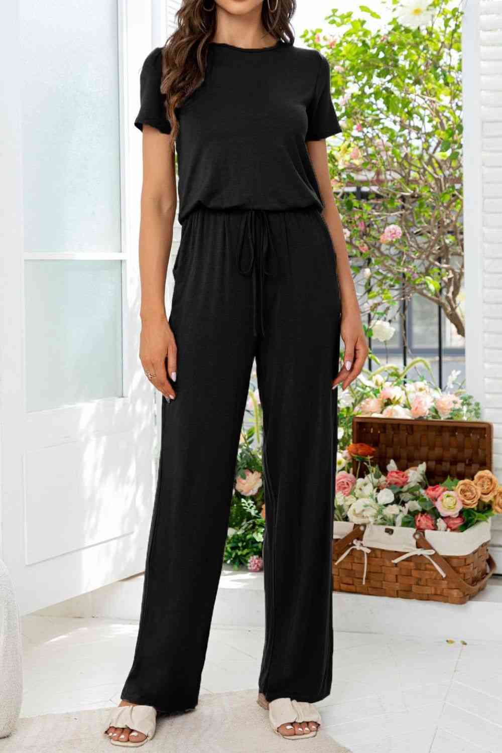 Stilla | Hals Åben Bag Jumpsuit Med Lommer