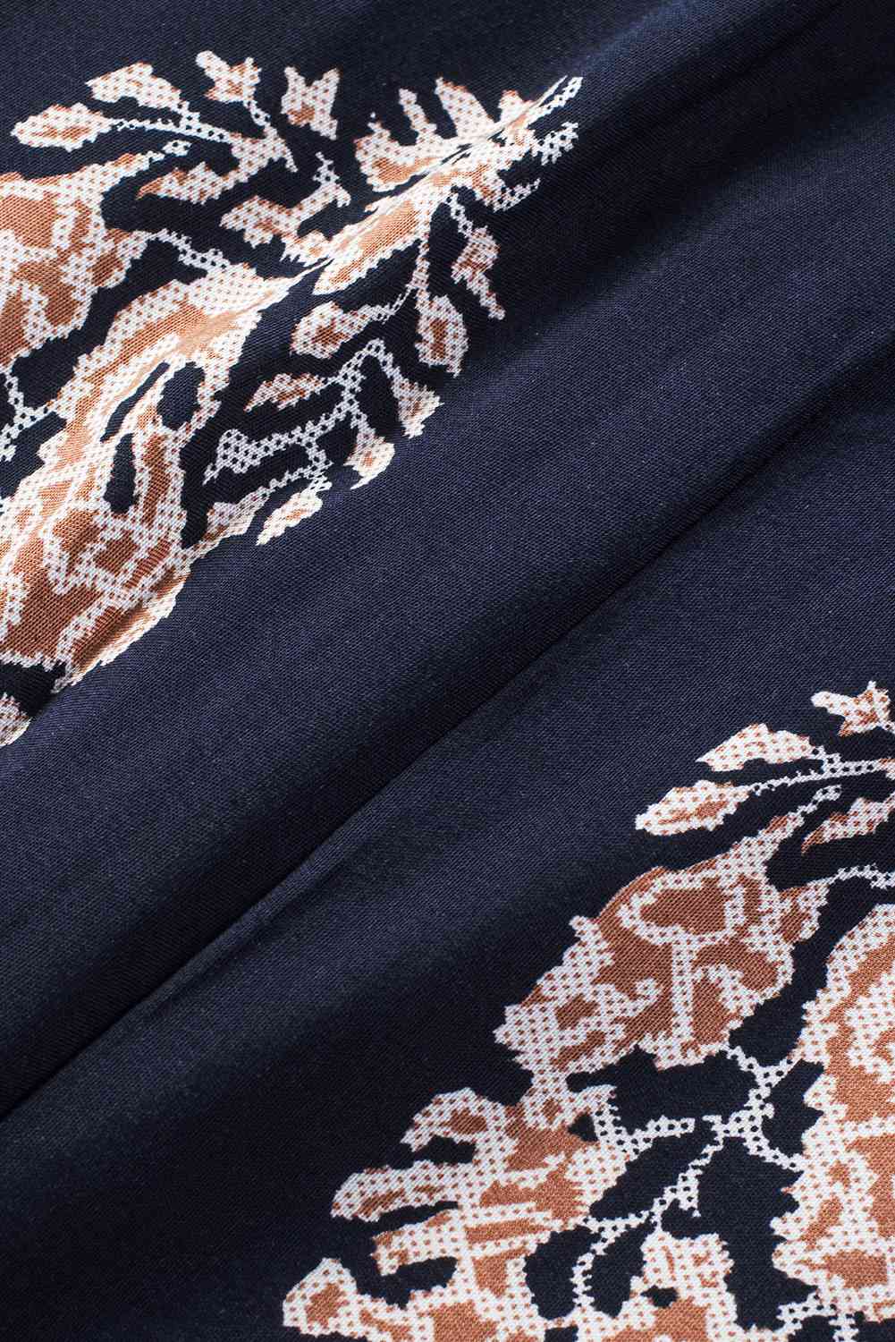 Stilla | V-hals ærmeløs jumpsuit