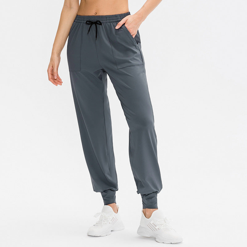 Dame Sporty Joggingbukser med praktiske lynlåslommer og fleksibel talje Stilla