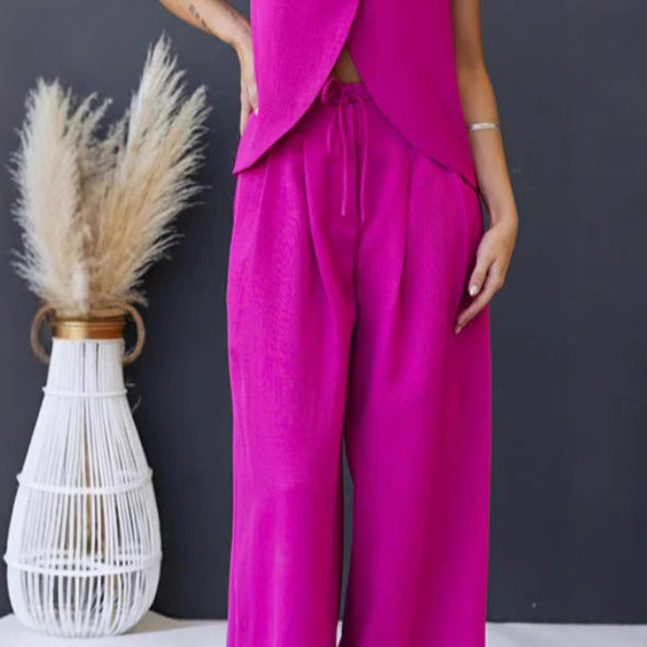 Dame luftig jumpsuit med asymmetrisk snit og stilfuld bindebælte Stiila