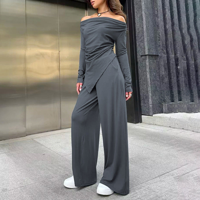 Dame jumpsuit med off-shoulder design og elegant draperet stof Stilla