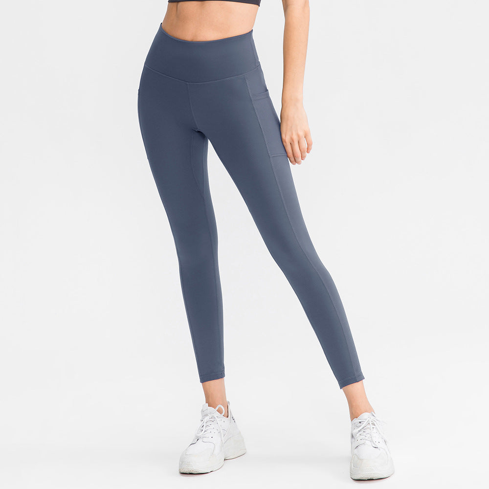 Dame højt skårne fitness leggings med praktiske sidelommer og fleksibelt materiale Stilla