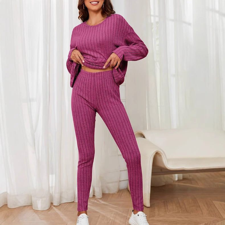 Dame afslappet langærmet top med praktisk lommefunktion og matchende leggings Stilla