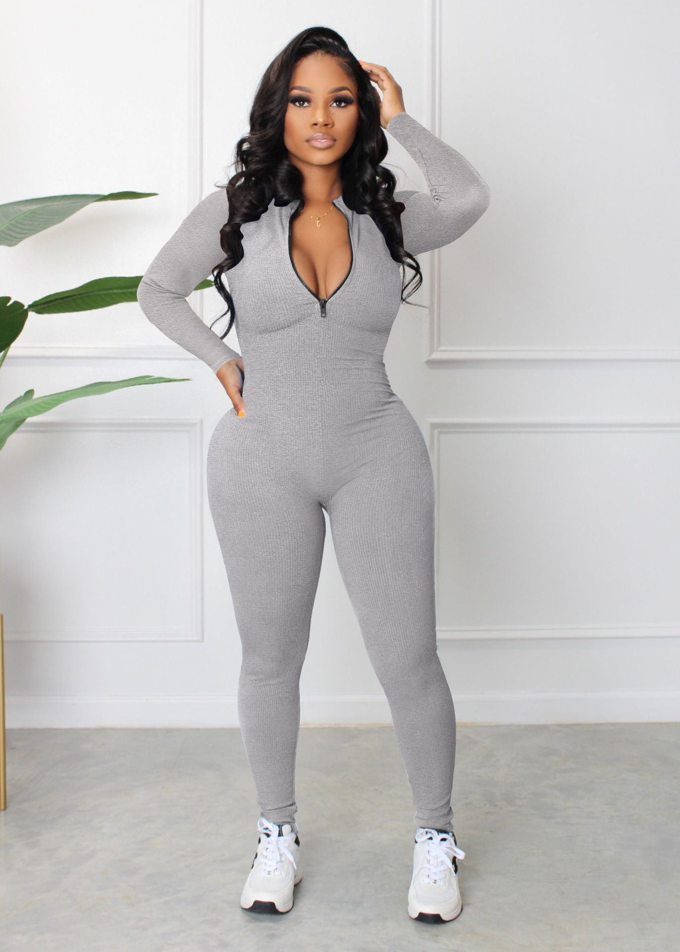 Dame sporty langærmet jumpsuit med lynlås og tætsiddende snit Stilla
