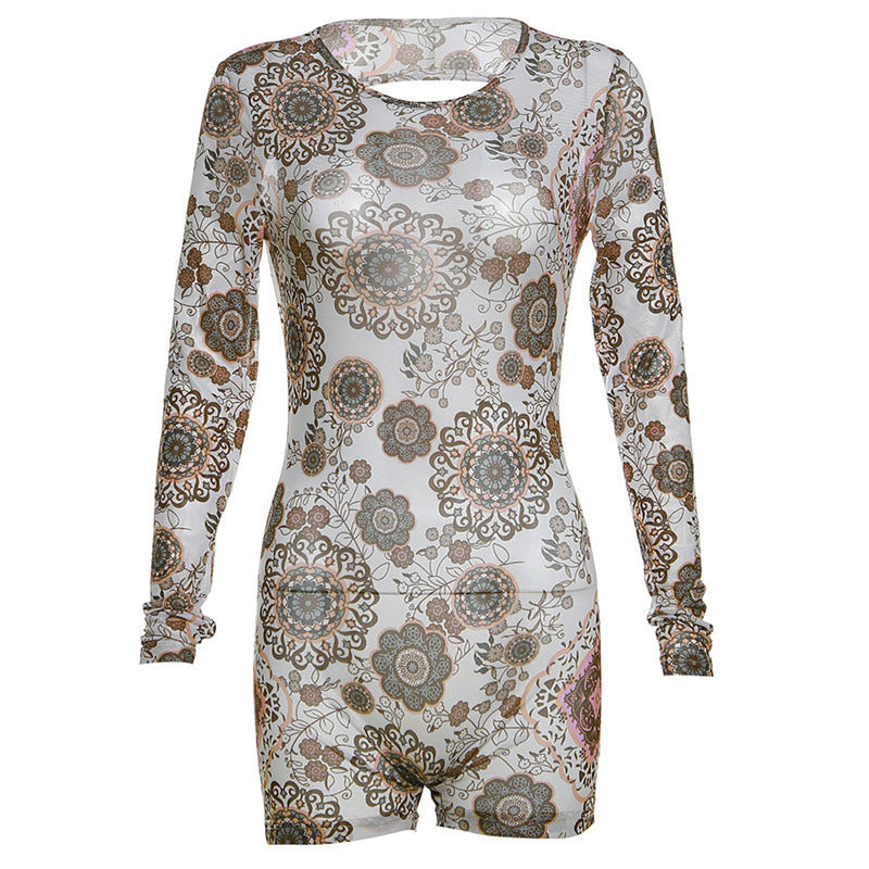 Dame Langærmet Jumpsuit med floral design og raffinerede cut-out detaljer Stilla