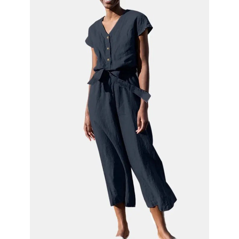 Dame let jumpsuit med taljebind og knapdetaljer Stilla