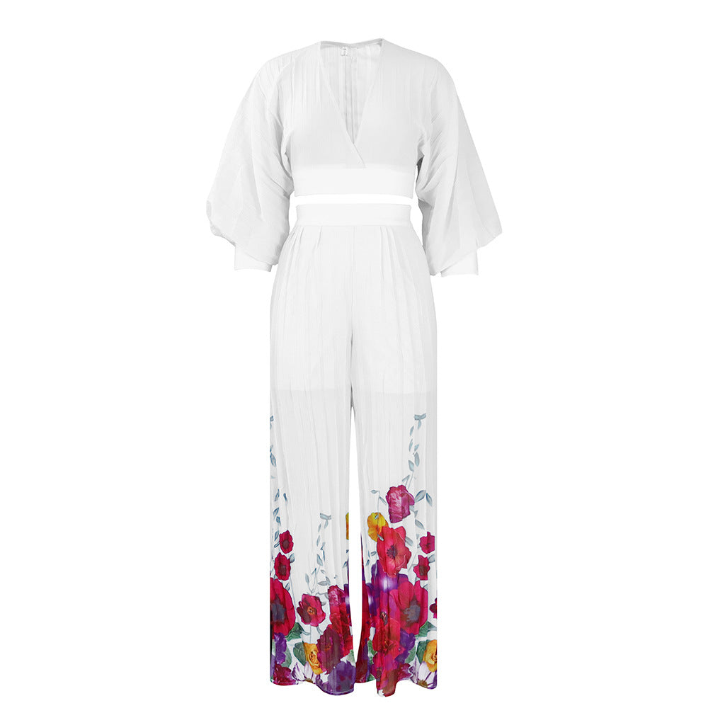 Dame let jumpsuit med elegante flæsekant og blomsterprint Stilla