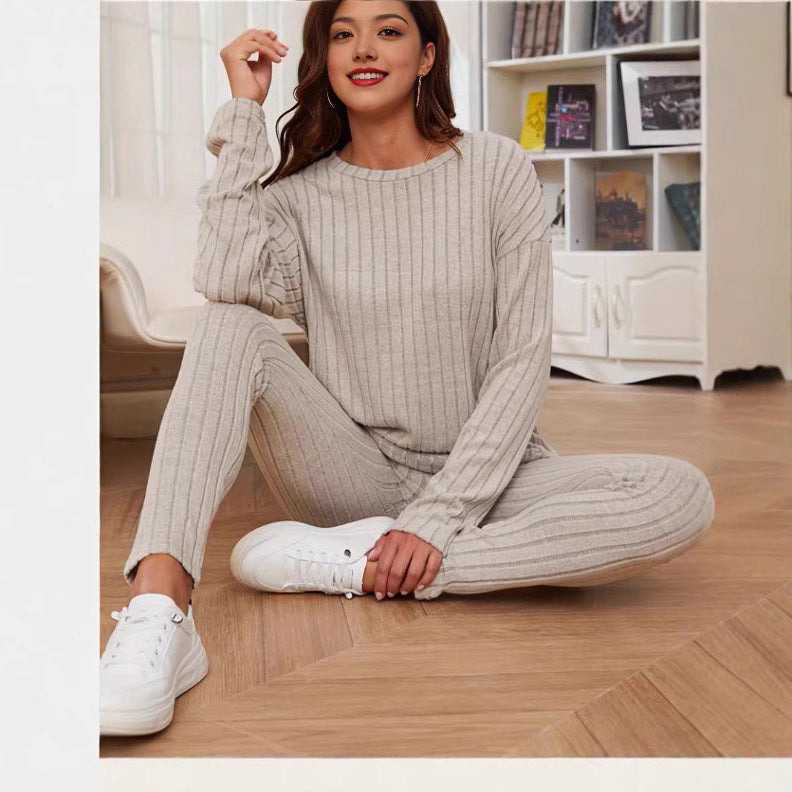 Dame afslappet langærmet top med praktisk lommefunktion og matchende leggings Stilla
