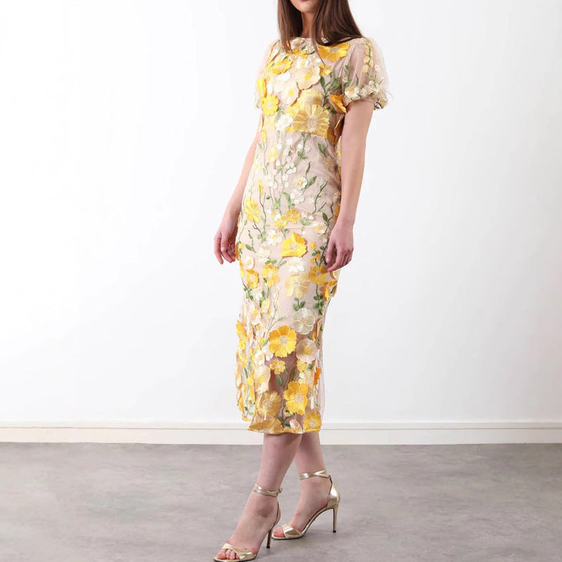 Dame Elegant blomsterkjole med transparent tyl og voluminøse pufærmer Stilla