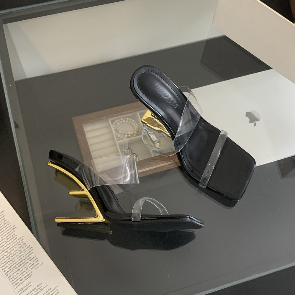 Dame åbne højhælede mules med transparent overmateriale og elegant metallisk accent Stilla