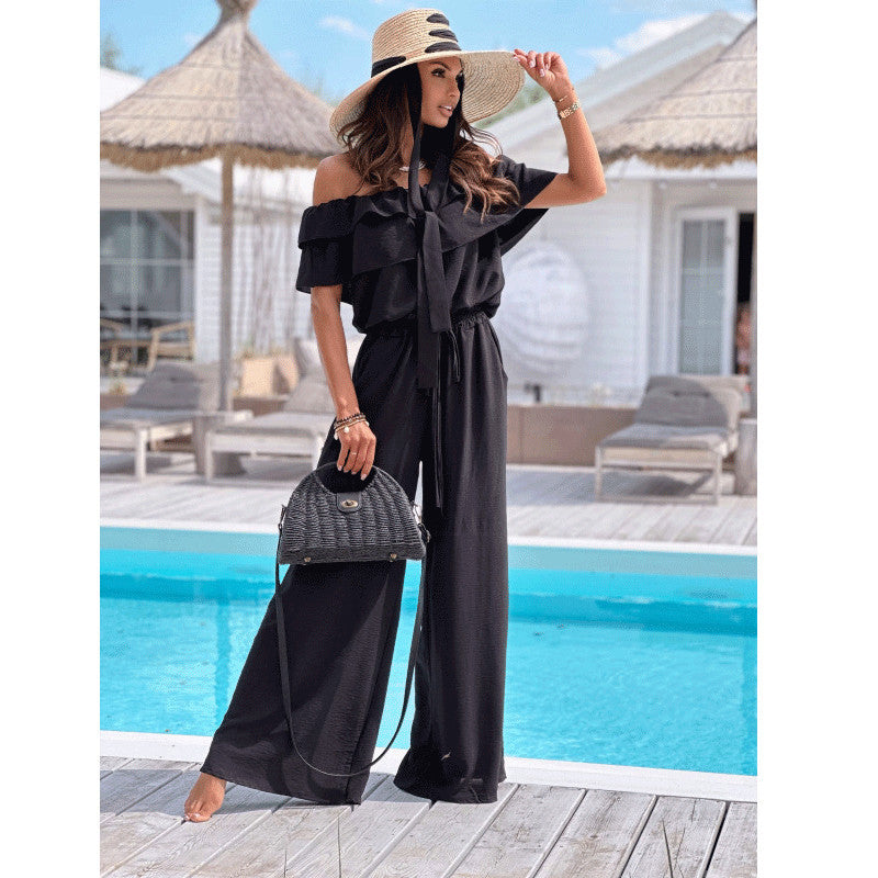 Dame elegant jumpsuit med off-shoulder udskæring og flydende snit Stilla