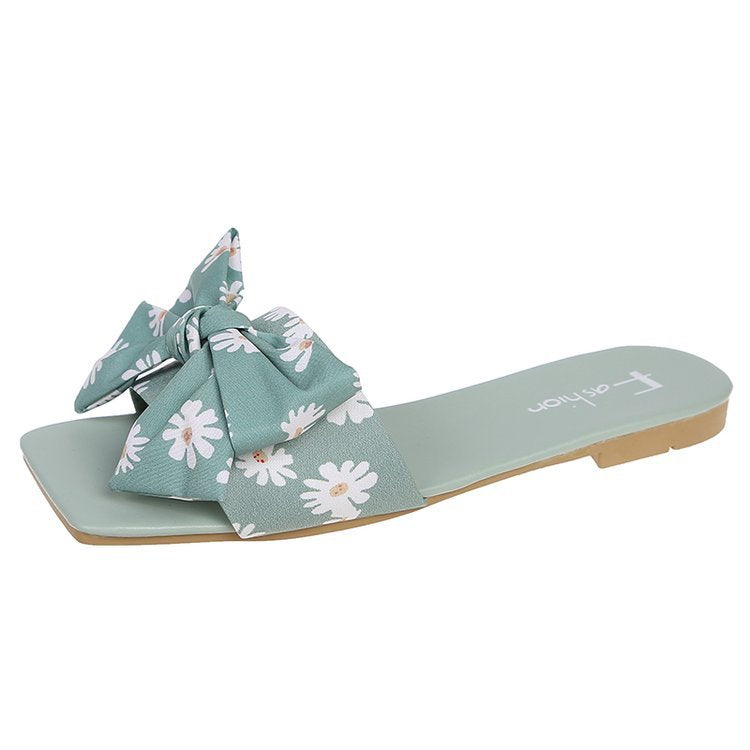 Dame fashionable slippers med legende blomsterdesign og elegante sløjfer Stilla