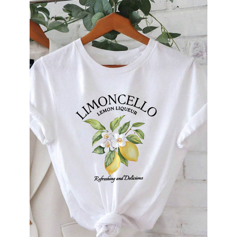 Dame T-shirt med frisk Limoncello-motiv og florale accenter Stilla