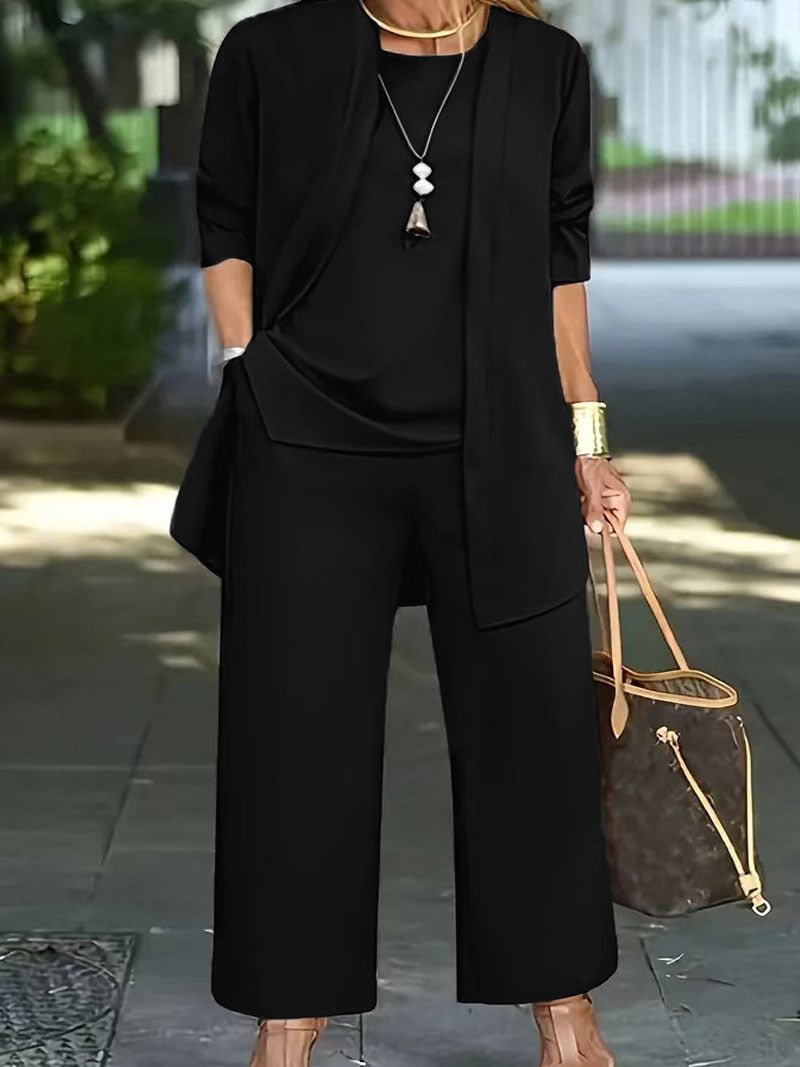 Dame Elegante og komfortabel todelt outfit med brede bukser og flydende top Stilla