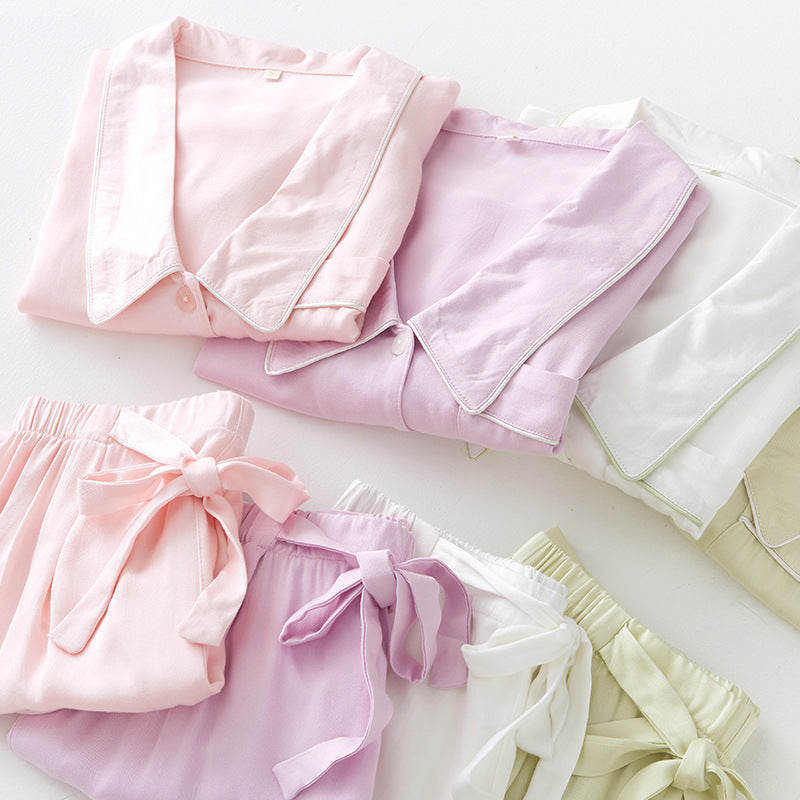 Dame natwear top med knaplukning og brystlomme Stilla