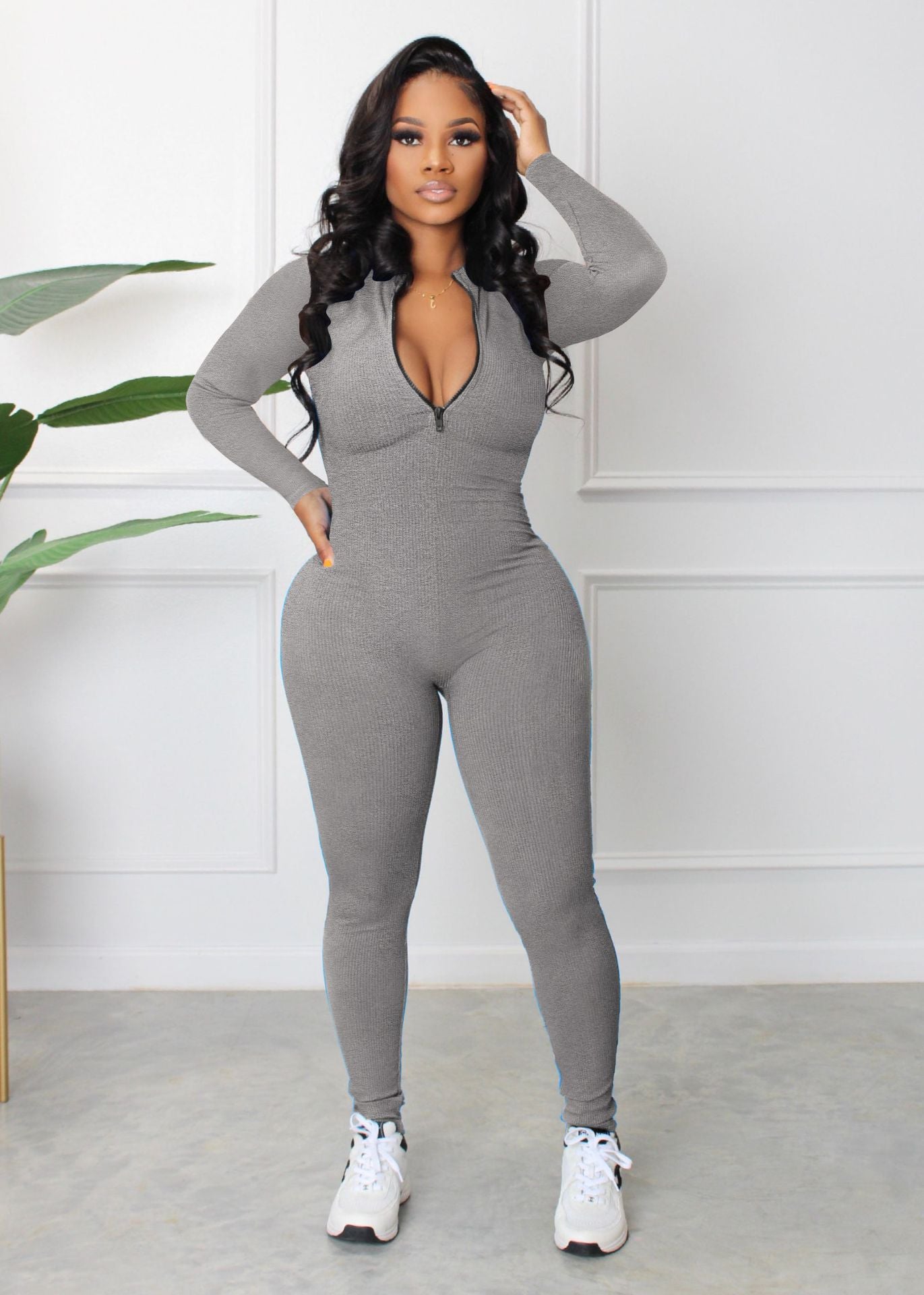 Dame sporty langærmet jumpsuit med lynlås og tætsiddende snit Stilla