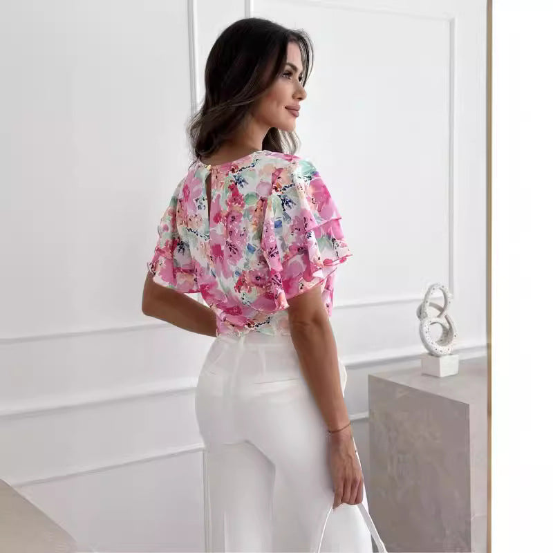 Damebluser med volumniøse flæseærmer og floral design Stilla