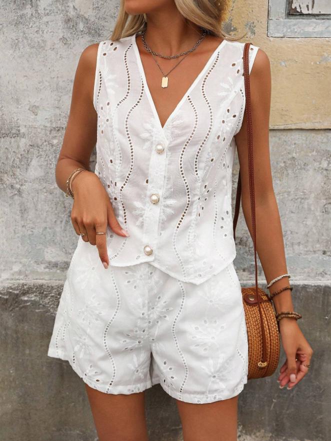 Dame kort jumpsuit med blomsterbort design og perleknapper Stilla