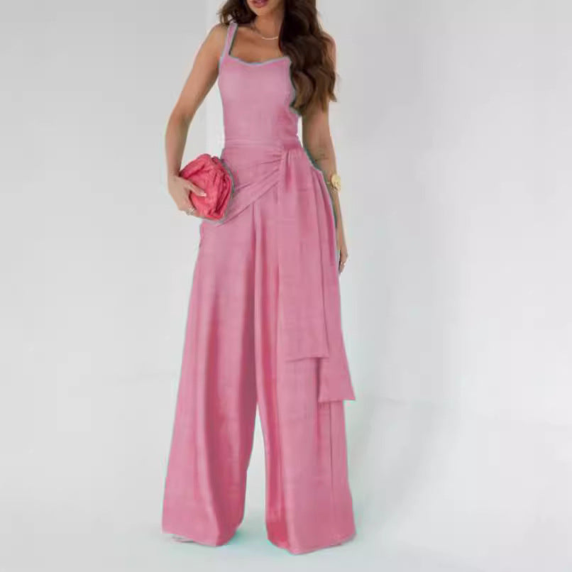 Dame bredt jumpsuit med elegante draperinger og stropper Stilla