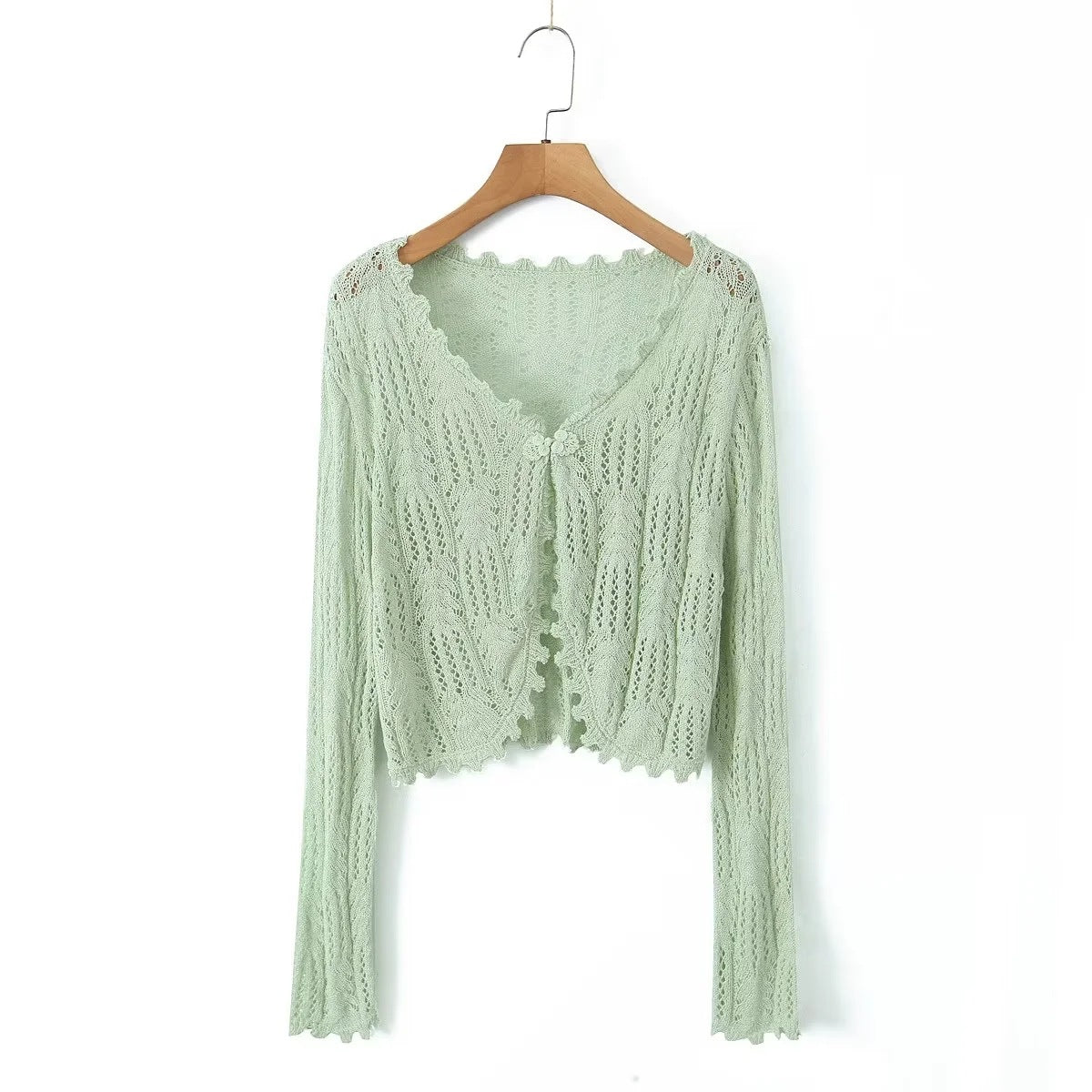 Dame strikcardigan med fint hulmønster og elegante flæsedetaljer Stilla