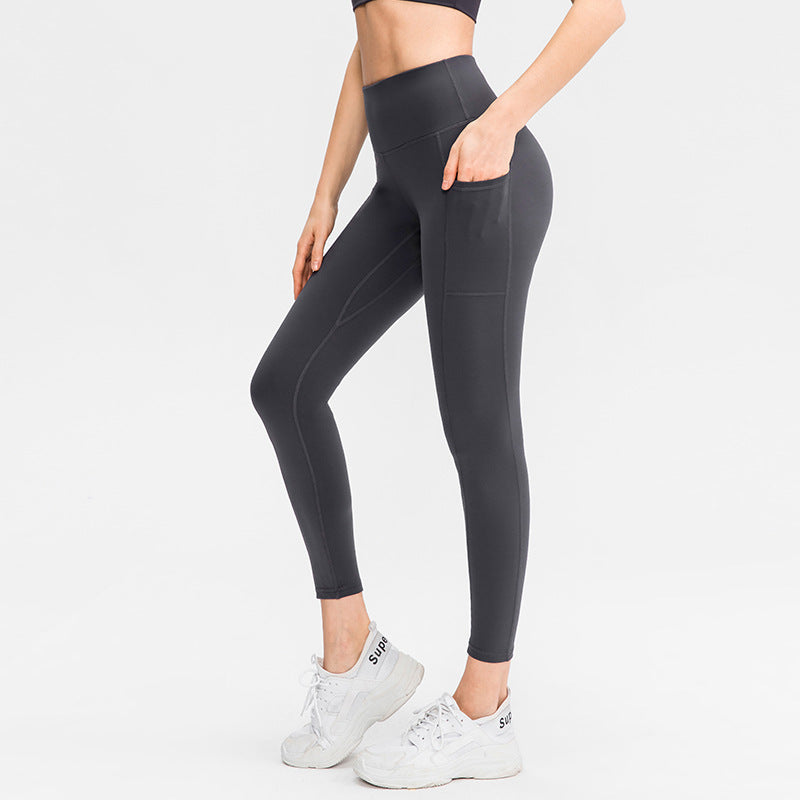Dame højt skårne fitness leggings med praktiske sidelommer og fleksibelt materiale Stilla