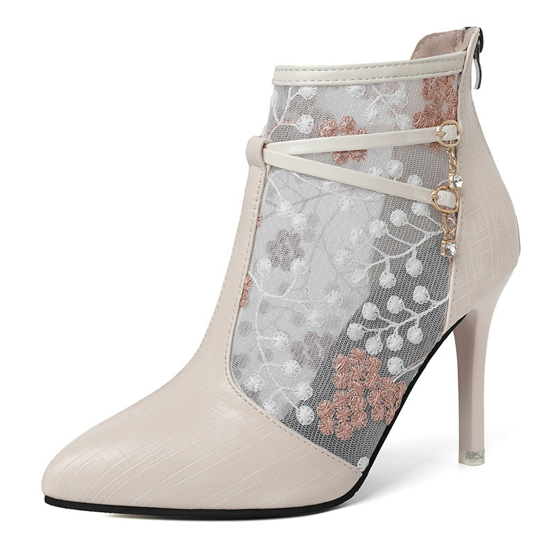 Dame elegante ankelstøvler med blomstertransparentdesign og moderigtigt detalje Stilla