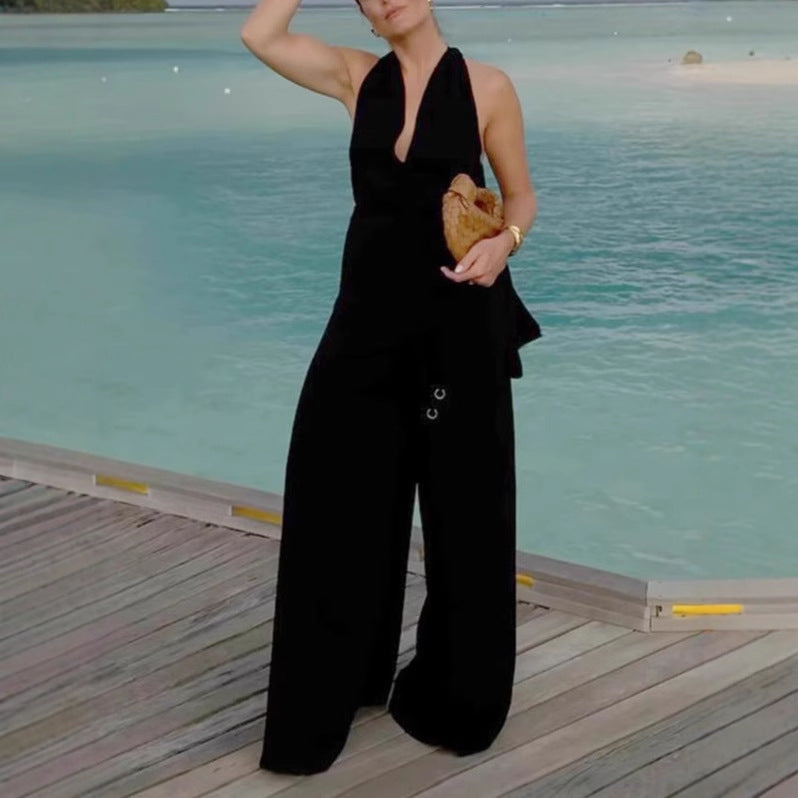 Dame jumpsuit med dyb V-udskæring og bredt ben Stilla