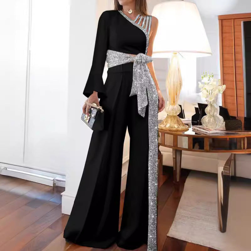 Dame elegant ensidig jumpsuit med glimmerdetaljer og bred ben Stilla
