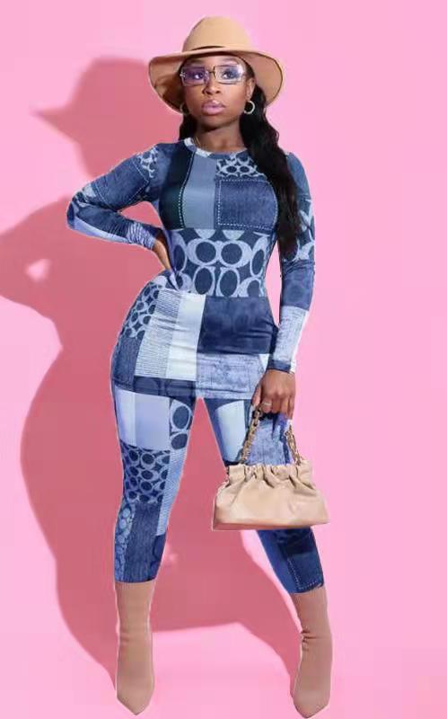 Dame jumpsuit i moderne patchworkdesign med lange ærmer og figursyet snit Stilla