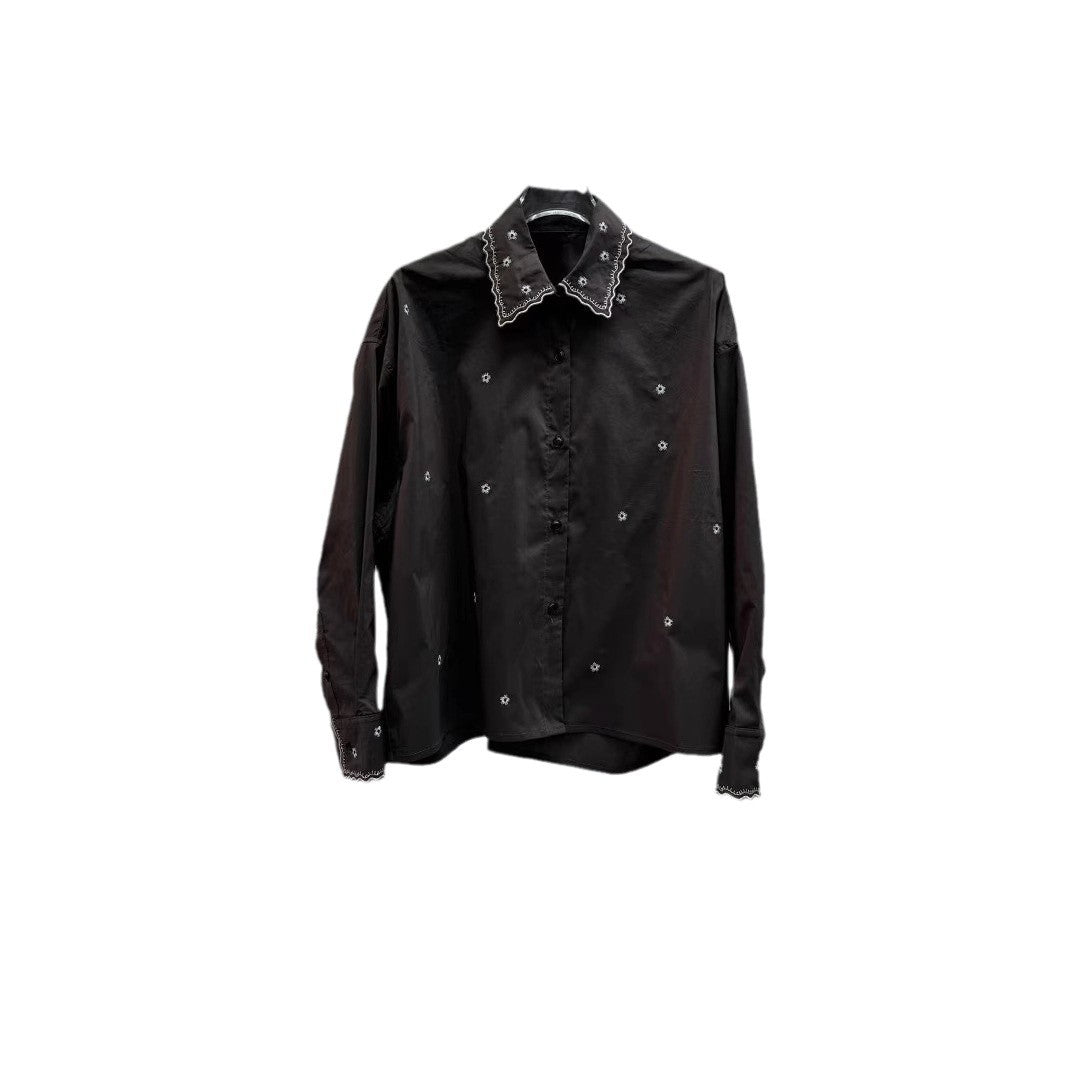 Dame afslappet bluse med filigran blomsterbroderedesign og vidde udskårne ærmer Stilla