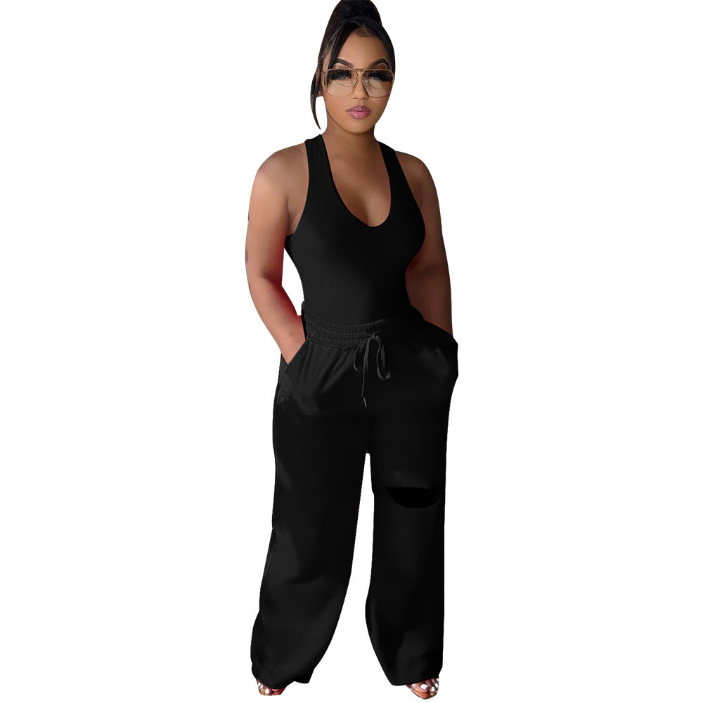 Dame sportlig jumpsuit med dyb V-udskæring og innovative lommer Stilla
