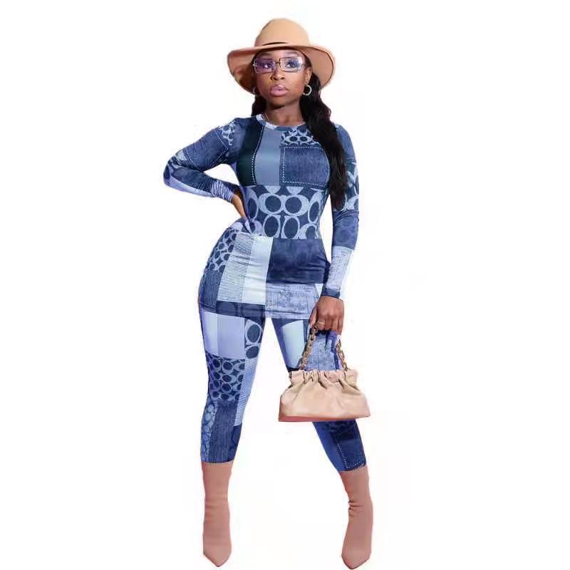 Dame jumpsuit i moderne patchworkdesign med lange ærmer og figursyet snit Stilla