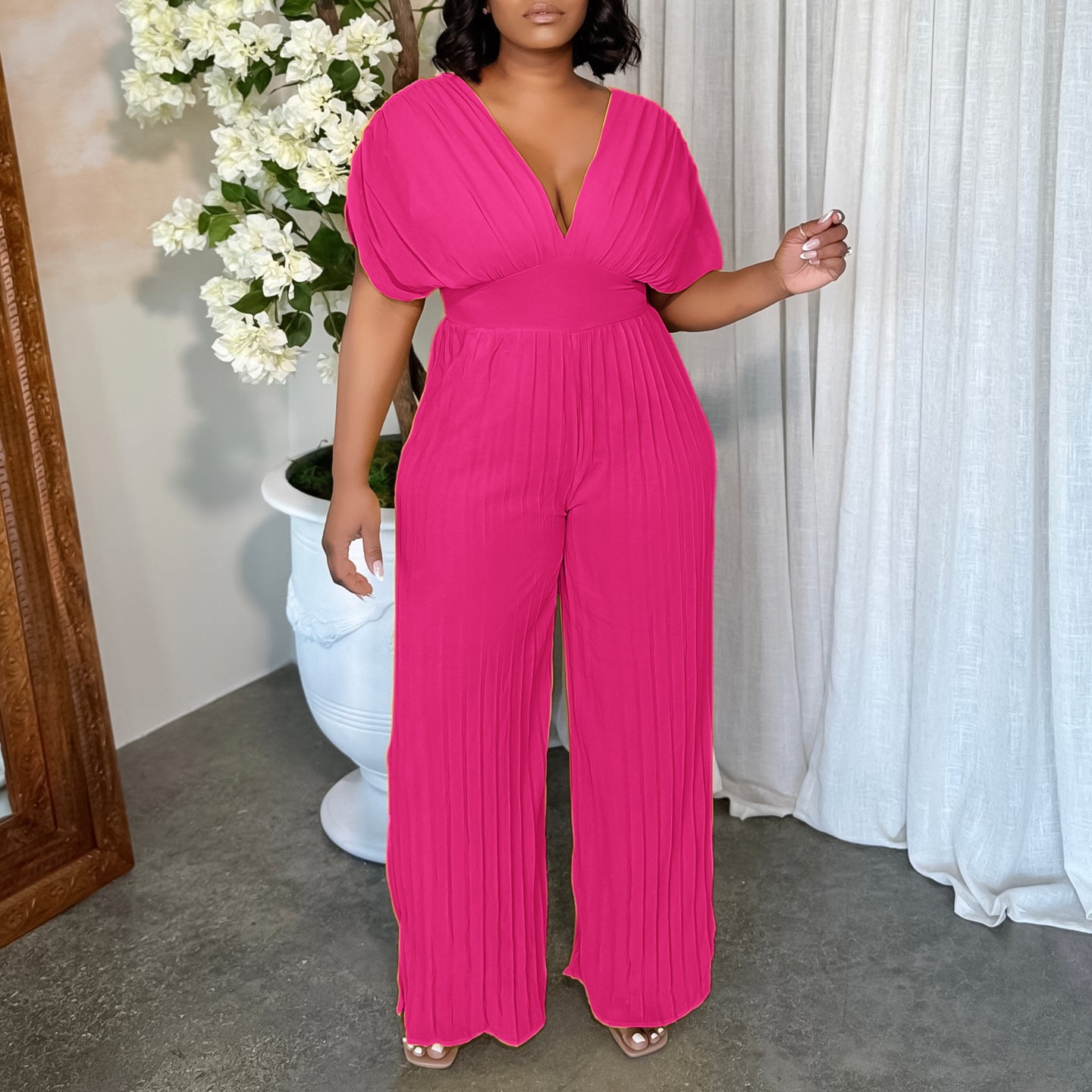 Dame Elegant Plisseret Jumpsuit med dyb V-udskæring og brede ærmer Stilla