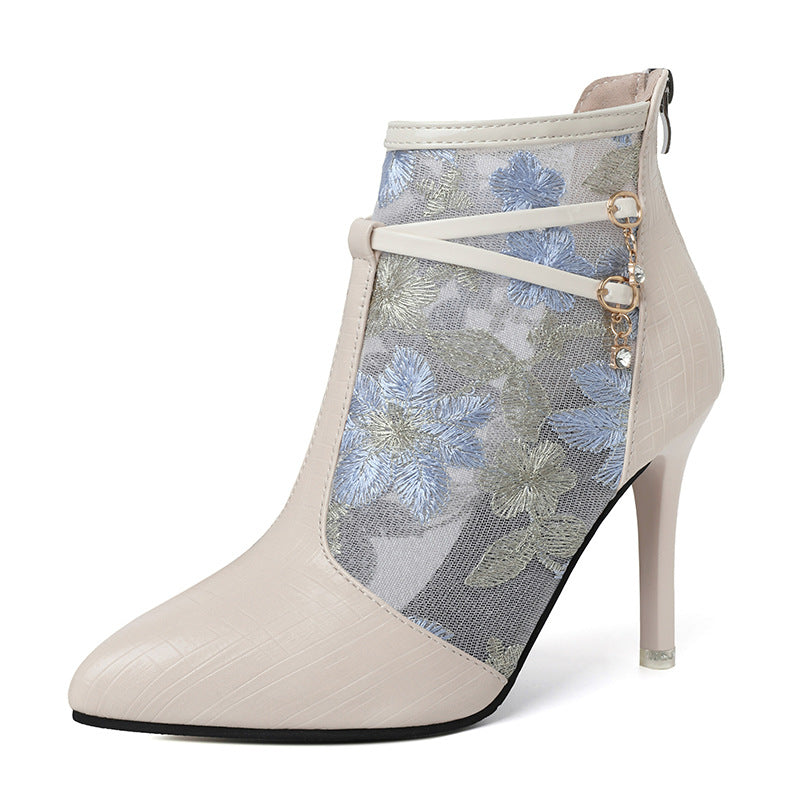 Dame elegante ankelstøvler med blomstertransparentdesign og moderigtigt detalje Stilla