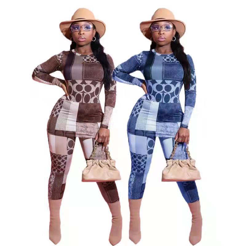 Dame jumpsuit i moderne patchworkdesign med lange ærmer og figursyet snit Stilla