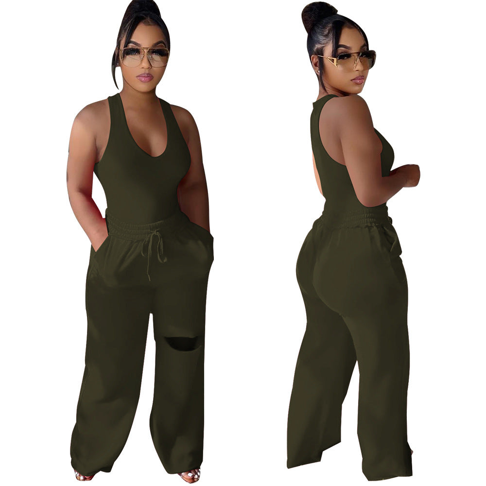 Dame sportlig jumpsuit med dyb V-udskæring og innovative lommer Stilla
