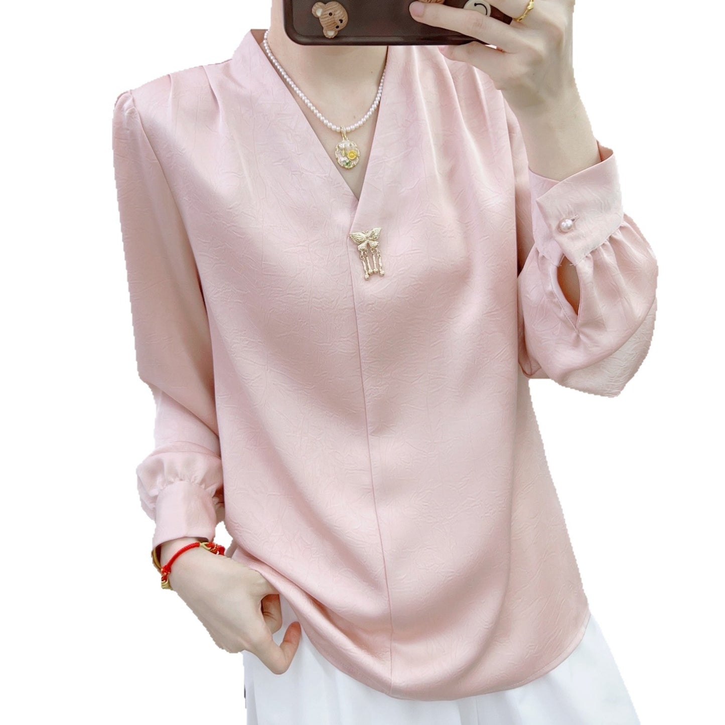 Dame elegant bluse med V-udskæring og dekorative pufærmer Stilla