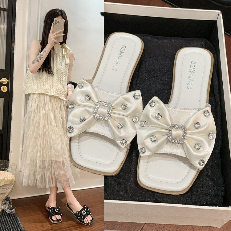 Dame Designer-sandaler med glamorøs sløjfedetalje og brusende strassdekorationer Stilla