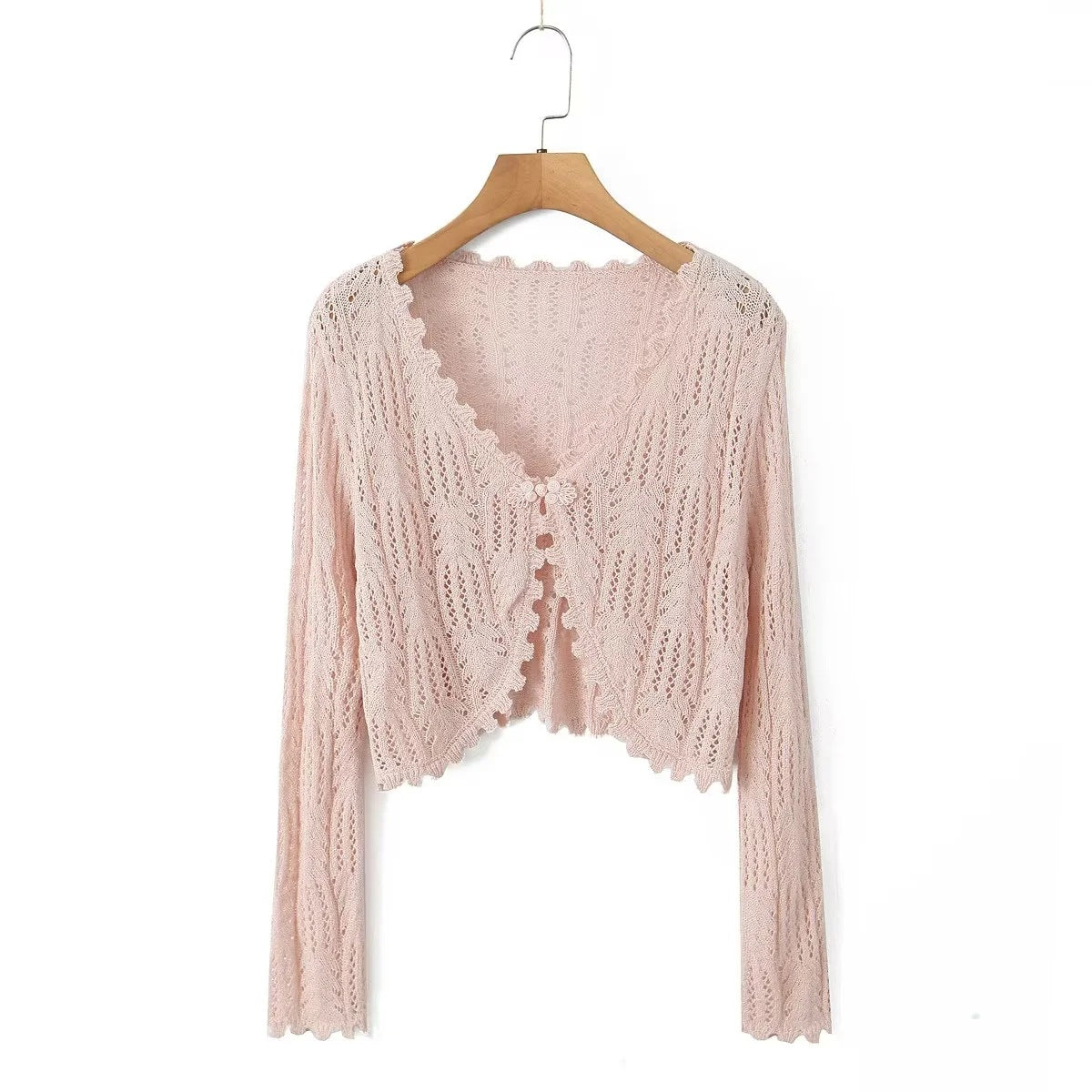 Dame strikcardigan med fint hulmønster og elegante flæsedetaljer Stilla
