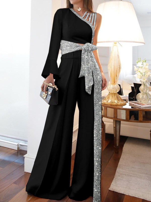 Dame elegant ensidig jumpsuit med glimmerdetaljer og bred ben Stilla