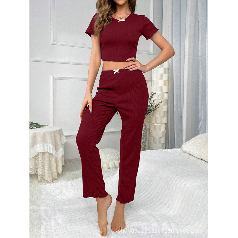 Dame fritids-jumpsuit med moderne ribdesign og legende sløjfedetalje Stilla