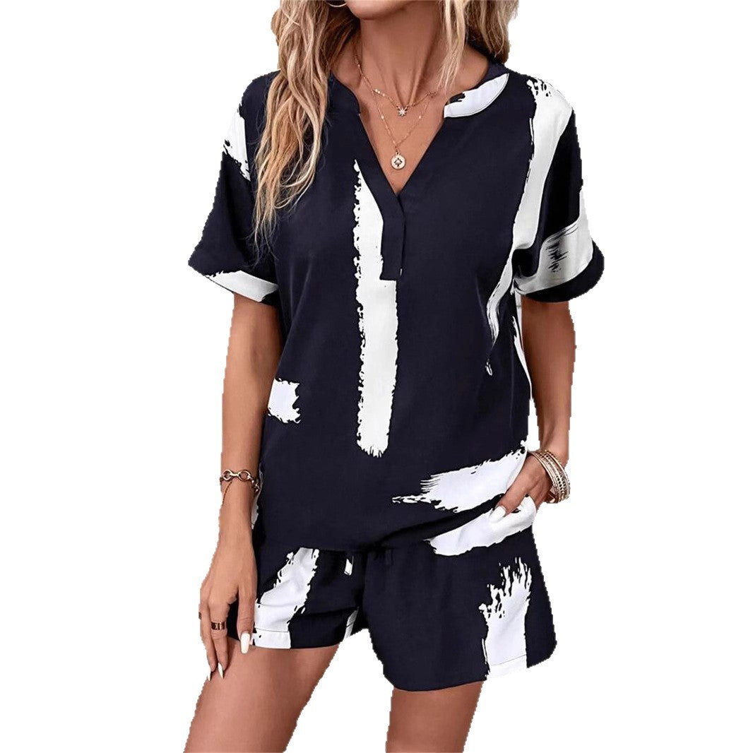 Damer kortærmet jumpsuit med moderne grafiktryk Stilla