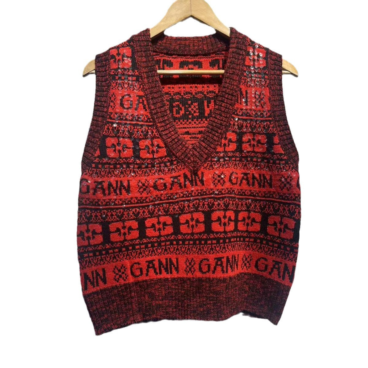 Dam strikvest med V-udskæring og festligt mønster Stilla