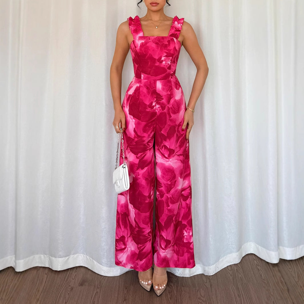 Dame jumpsuit med floral design og raffinerede flæsedetaljer Stilla