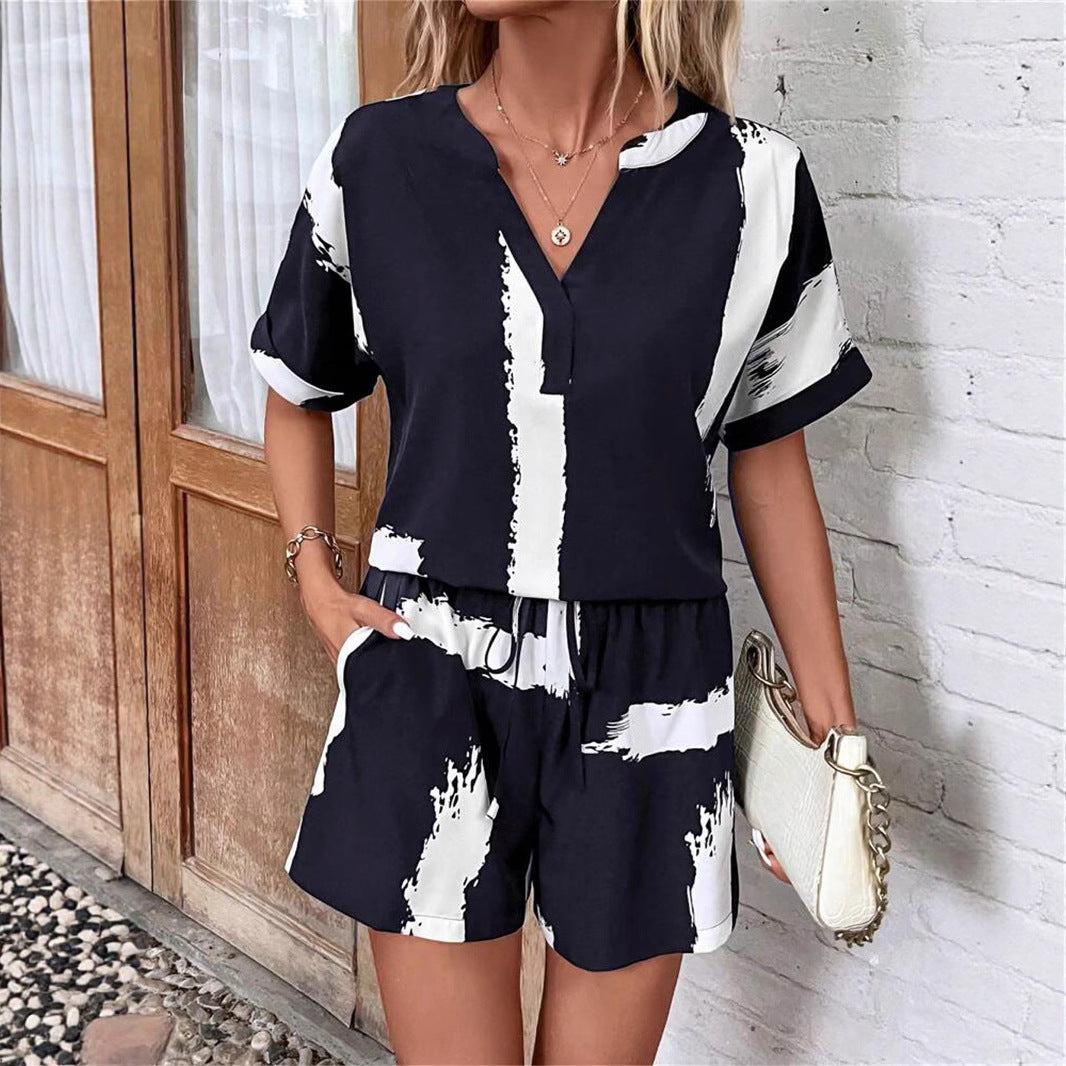 Damer kortærmet jumpsuit med moderne grafiktryk Stilla