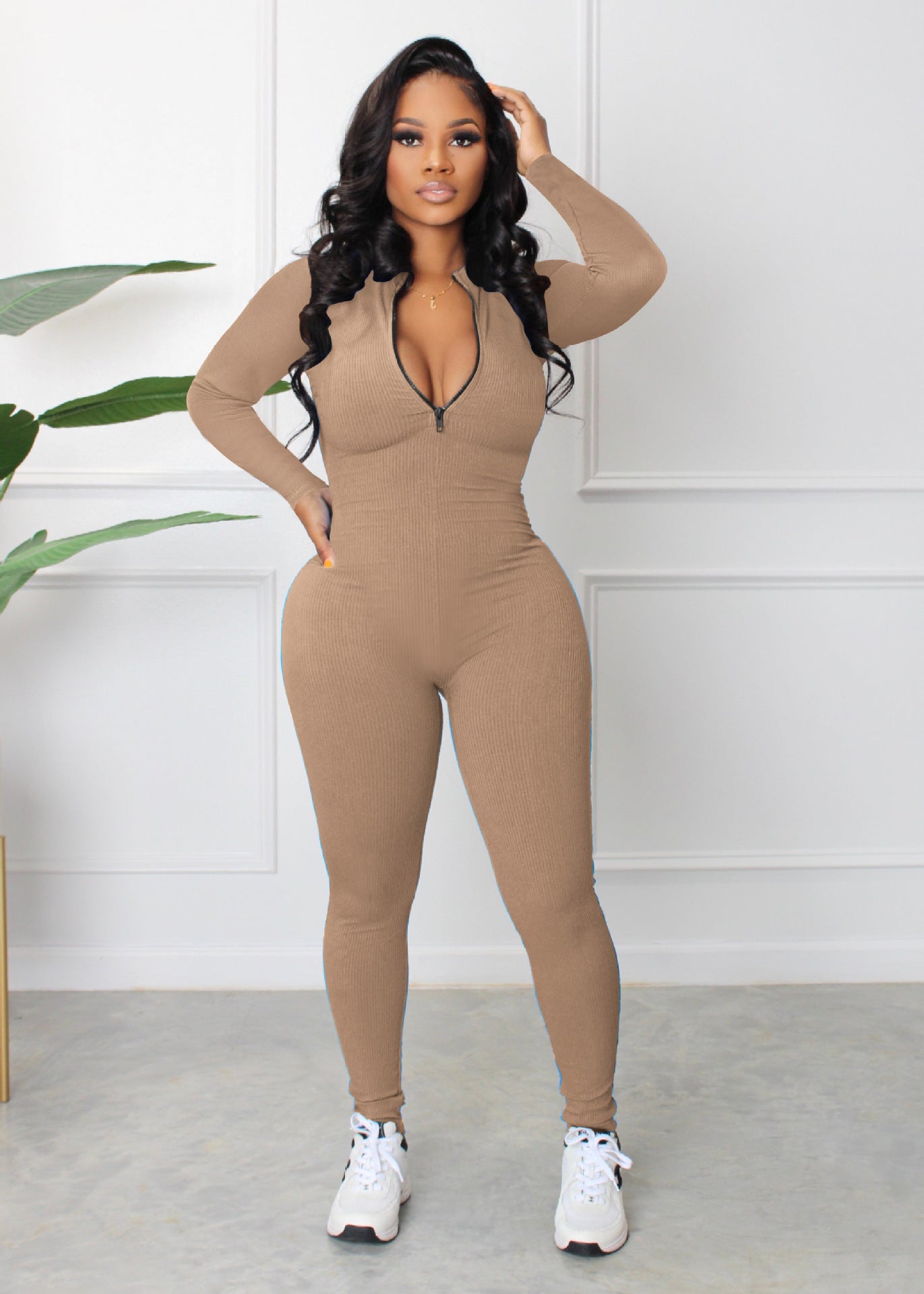 Dame sporty langærmet jumpsuit med lynlås og tætsiddende snit Stilla